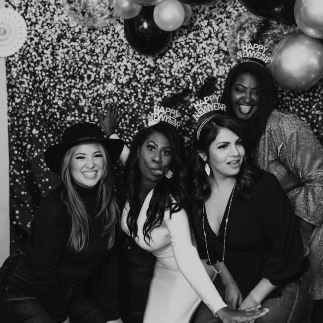 a group of women standing next to each other