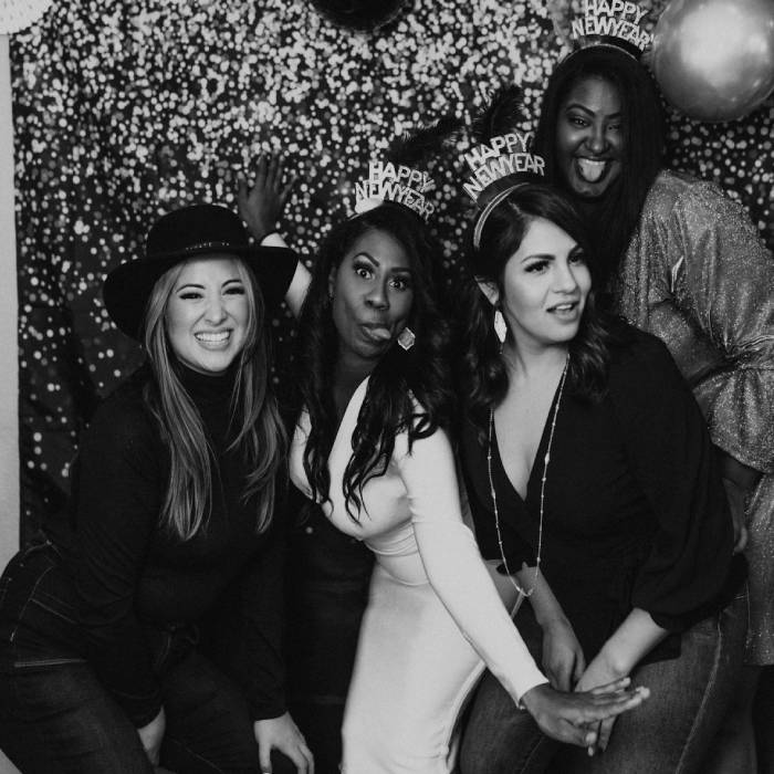 a group of women standing next to each other